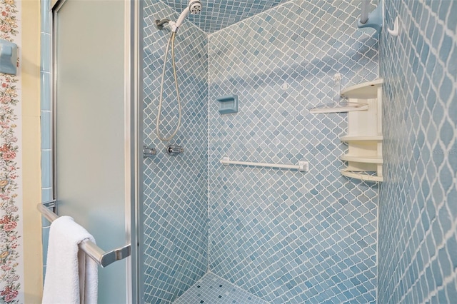 bathroom with tiled shower