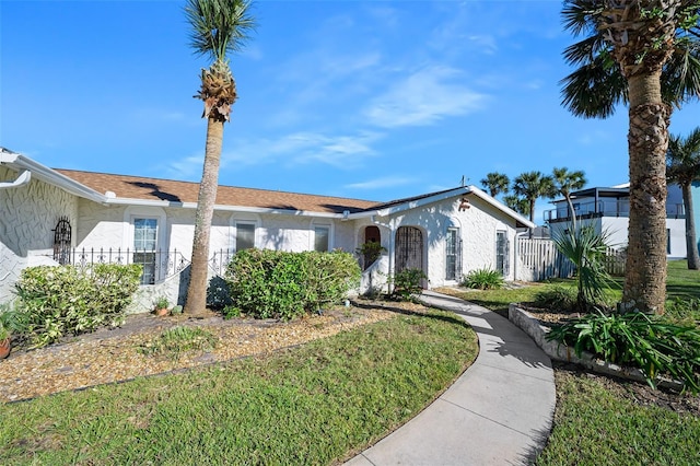 ranch-style house with a front yard