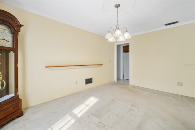 unfurnished dining area with crown molding, light colored carpet, and an inviting chandelier