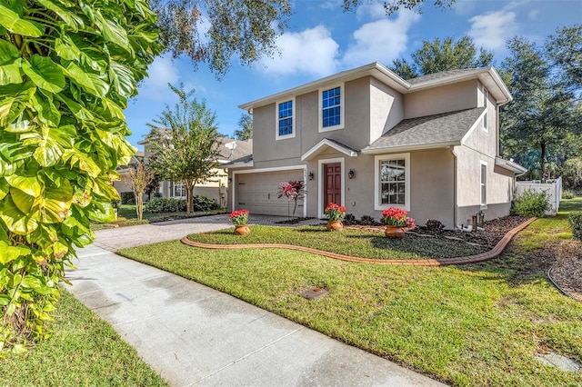 view of front of house with a garage and a front lawn