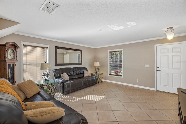 tiled living room with a textured ceiling and ornamental molding