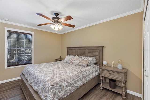 bedroom featuring a textured ceiling, dark hardwood / wood-style flooring, ceiling fan, and ornamental molding