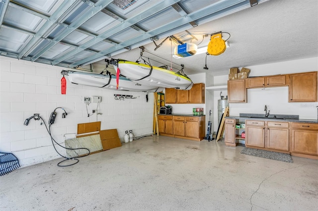 garage with a garage door opener and sink