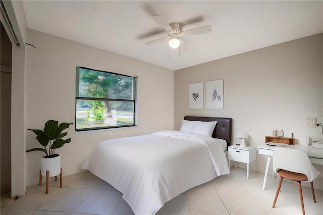 tiled bedroom with ceiling fan