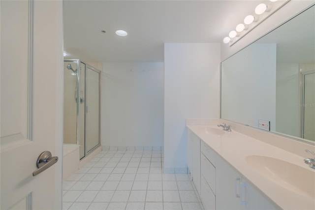 bathroom featuring tile patterned floors, vanity, and an enclosed shower