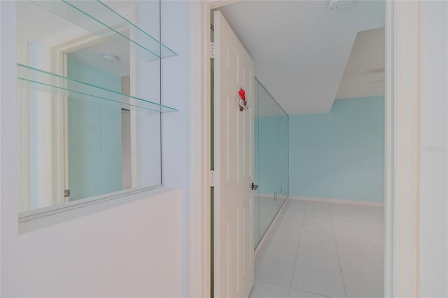 hallway with light tile patterned floors