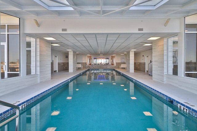 view of pool featuring a skylight