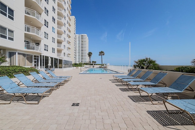 view of pool featuring a patio