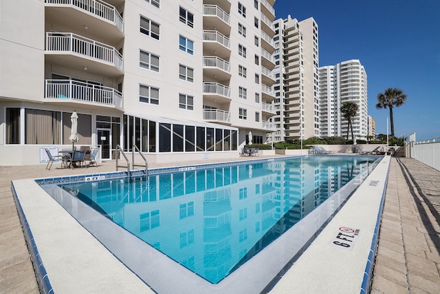 view of swimming pool featuring a patio area