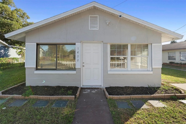 exterior space with a front lawn