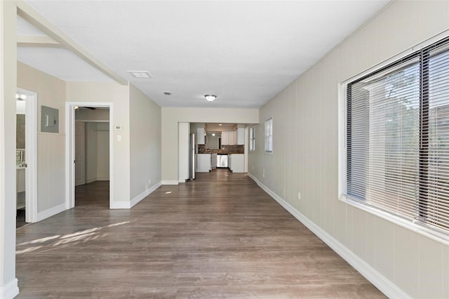 hallway with hardwood / wood-style flooring