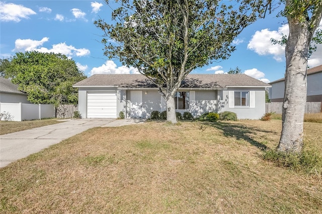 ranch-style home with a front yard and a garage