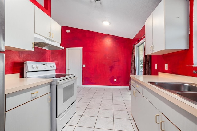 kitchen featuring white cabinets, vaulted ceiling, and white range with electric stovetop