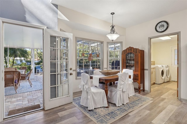 dining room featuring washer and dryer and light wood-type flooring