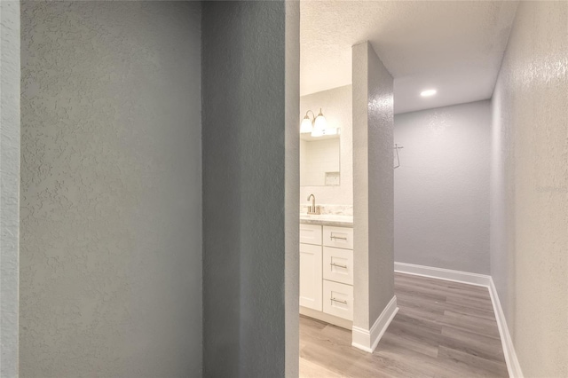 bathroom with hardwood / wood-style floors and vanity