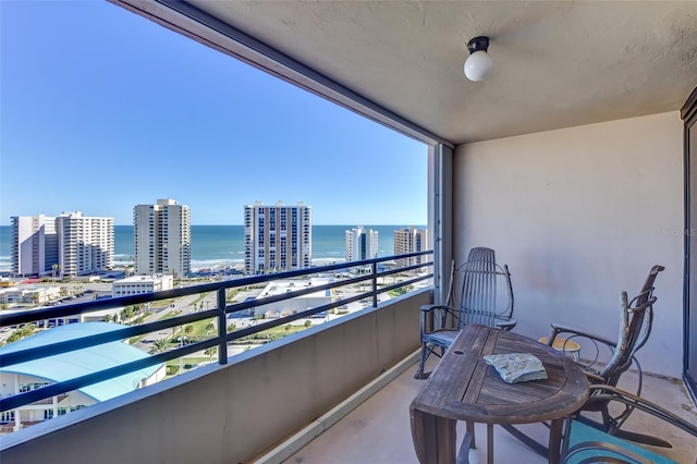 balcony featuring a water view