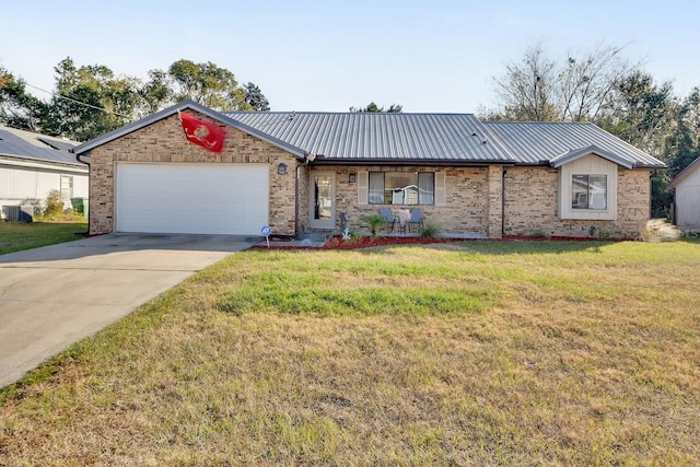 ranch-style home with a garage and a front lawn