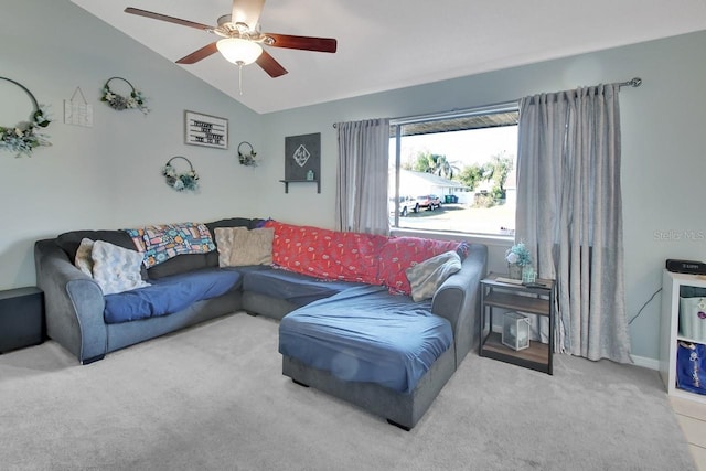 living room with ceiling fan, lofted ceiling, and light carpet