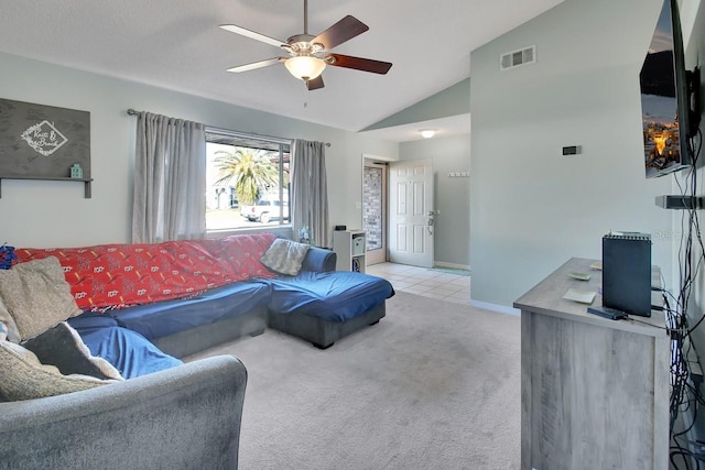 carpeted living room featuring ceiling fan and vaulted ceiling