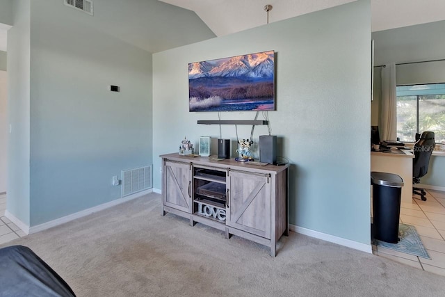 carpeted living room featuring vaulted ceiling