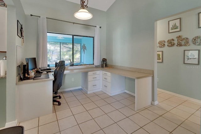 tiled home office featuring built in desk