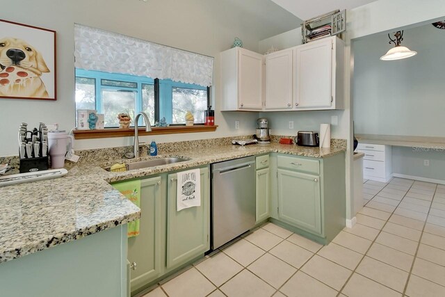 kitchen with sink, green cabinetry, dishwasher, white cabinetry, and hanging light fixtures