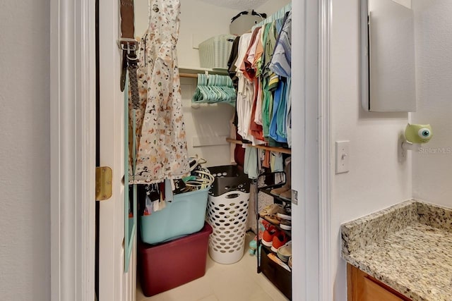 bathroom with tile patterned flooring and vanity