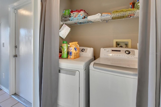 laundry room with separate washer and dryer