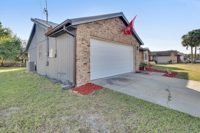 garage with cooling unit and a lawn