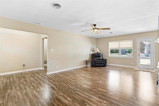 interior space featuring wood-type flooring and ceiling fan