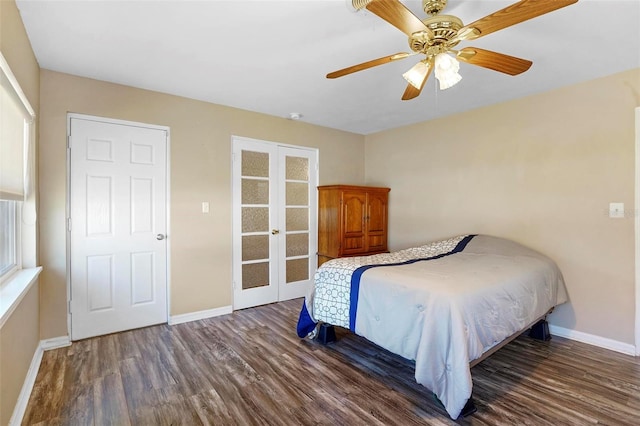 bedroom with ceiling fan, french doors, and dark wood-type flooring