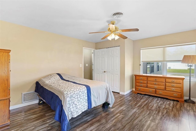 bedroom with ceiling fan, dark hardwood / wood-style floors, and a closet