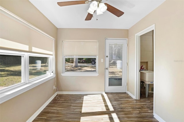 unfurnished sunroom with ceiling fan and a wealth of natural light