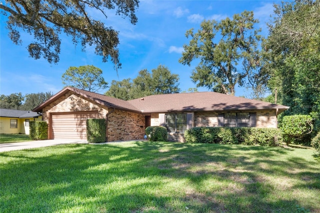 ranch-style home with a garage and a front yard