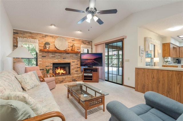 living room featuring plenty of natural light, lofted ceiling, and light carpet