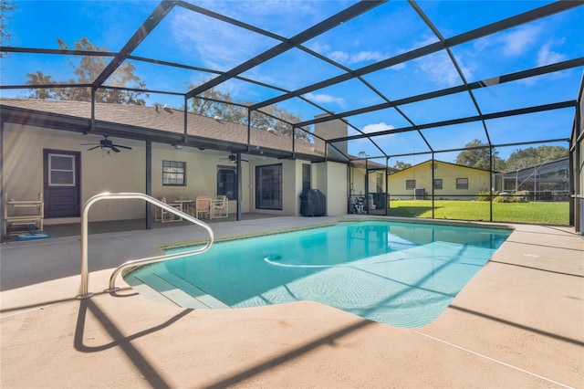 view of pool featuring ceiling fan, area for grilling, a patio area, and glass enclosure