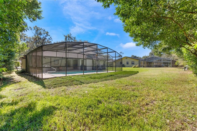 view of yard with glass enclosure