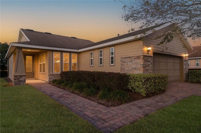 exterior space with a lawn and a garage