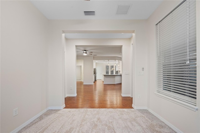 hall featuring wood-type flooring