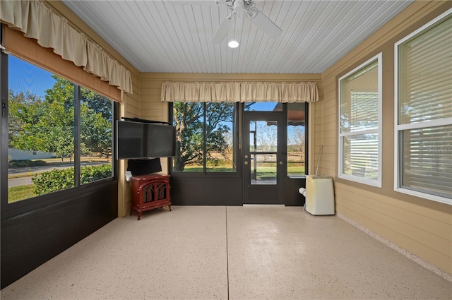 sunroom / solarium with plenty of natural light and ceiling fan