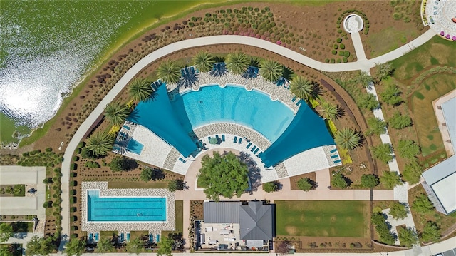 birds eye view of property with a water view