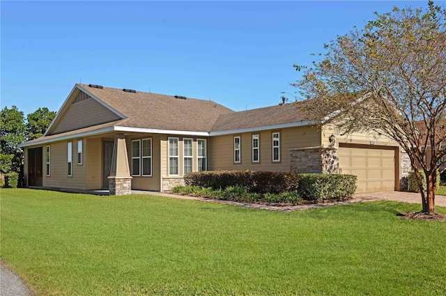 view of front of house with a garage and a front yard