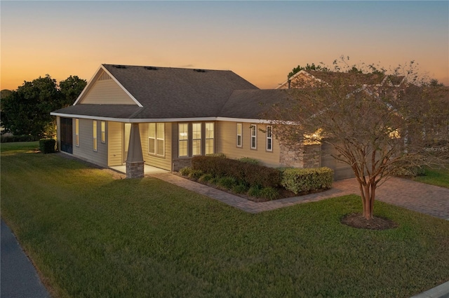 view of front of house with a yard