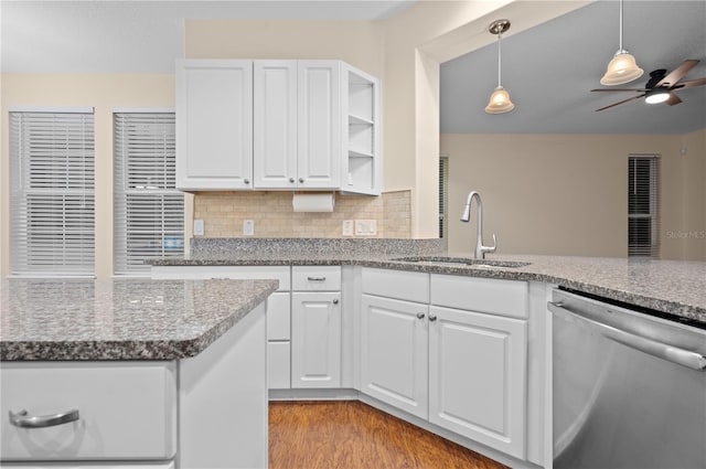 kitchen with dishwasher, white cabinets, sink, ceiling fan, and light wood-type flooring