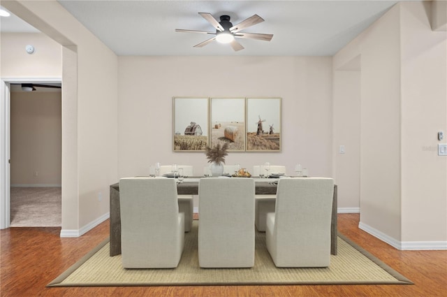 dining room with hardwood / wood-style flooring and ceiling fan