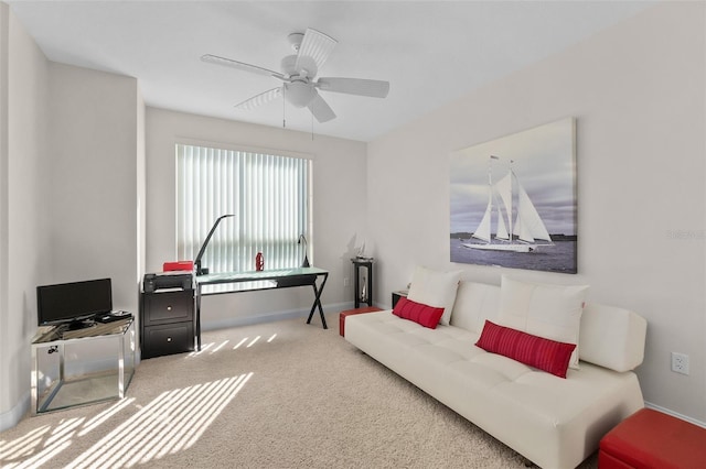 carpeted living room featuring ceiling fan