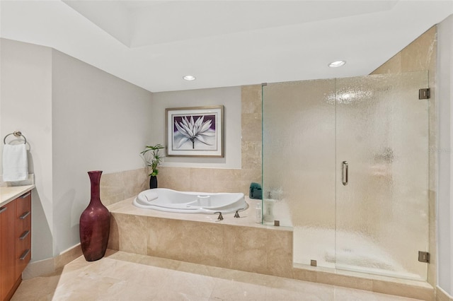 bathroom with tile patterned floors, vanity, and plus walk in shower