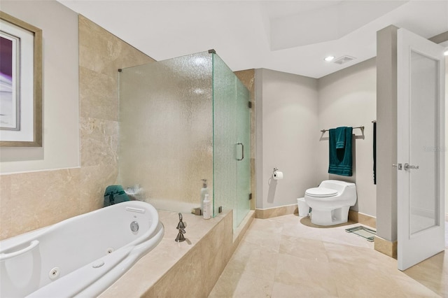 bathroom featuring separate shower and tub, tile patterned floors, and toilet