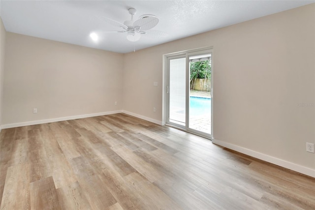 unfurnished room featuring ceiling fan and light hardwood / wood-style flooring