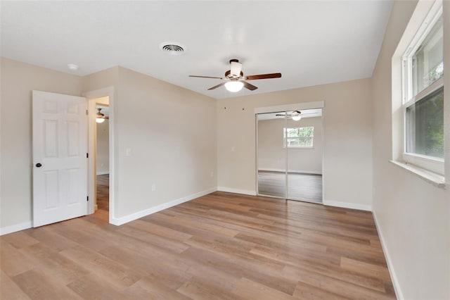 spare room with light hardwood / wood-style floors